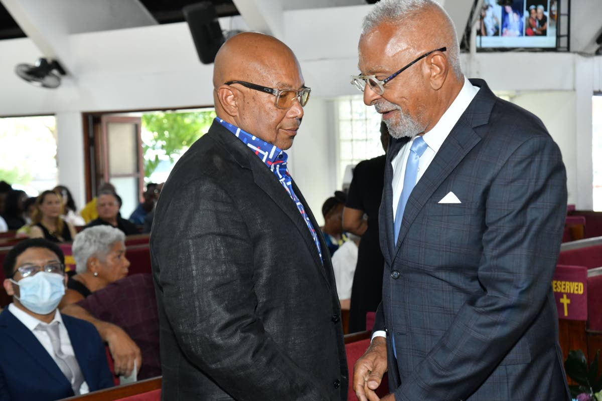 Director and Co Founder of First Rock Group Dr Michael Banbury (right) shares a moment with Mayberry Chairman Chris Berry (left) during the funeral for Doris ‘May’ Berry, founding director of Mayberry Investments Limited at the Webster Memorial United 