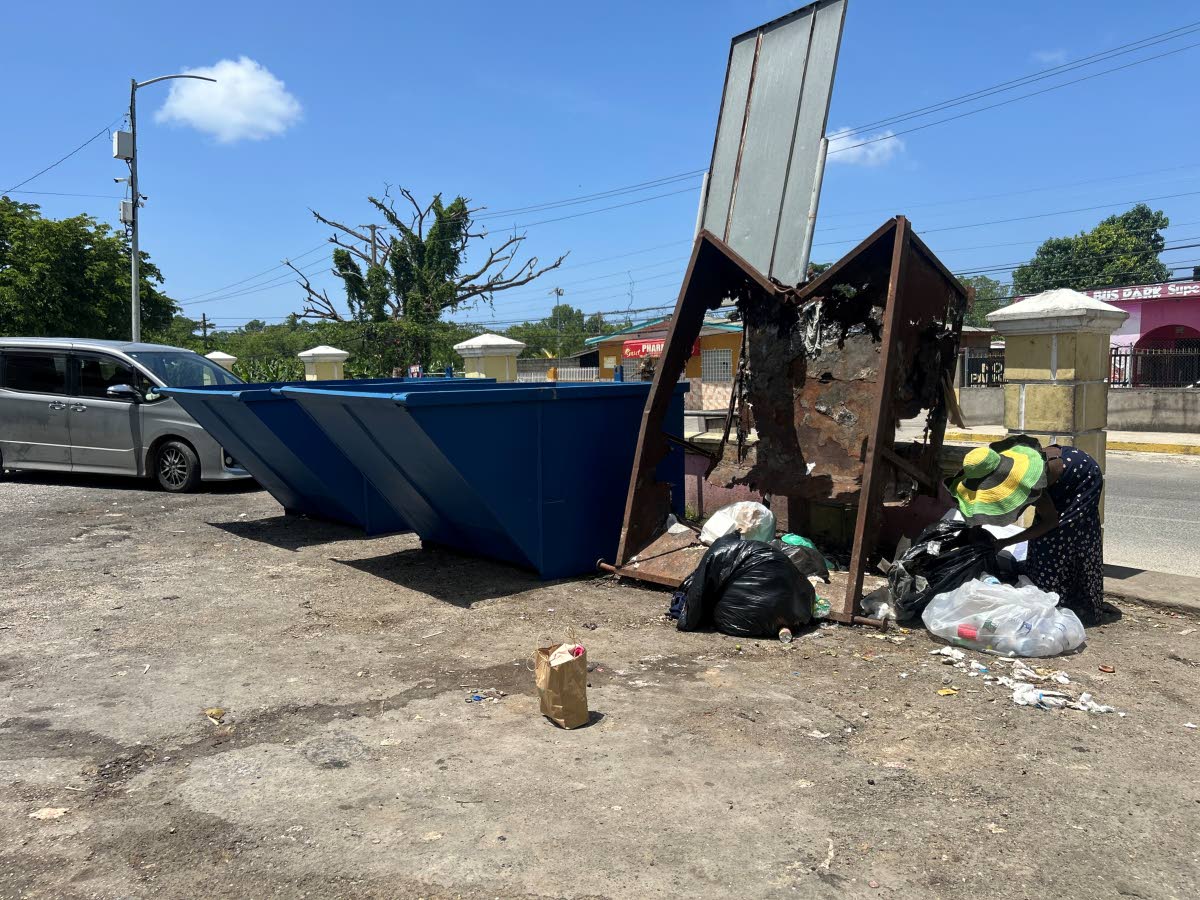 The New skips placed beside the old beaten skip in the Negril bus park. 
Pic 2: One of the illegal dumpsites which was replaced by one of the five skips at one section of the Whitehall District in Negril.