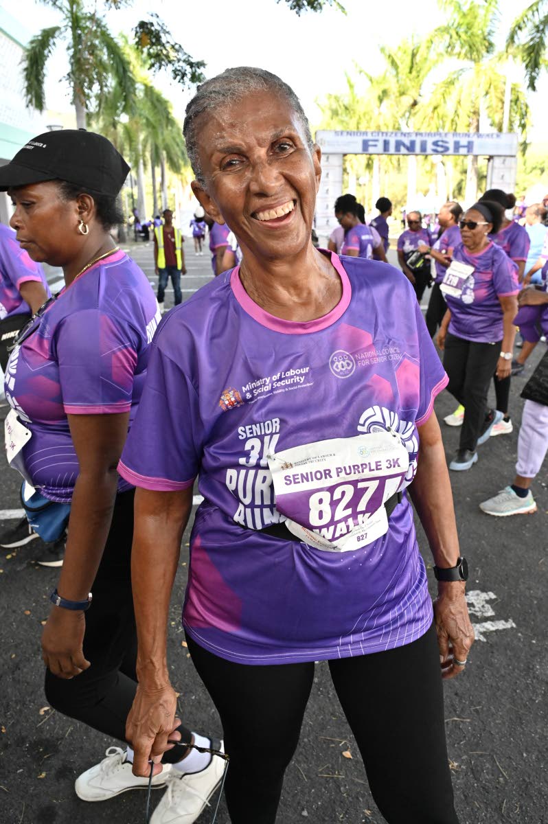 Judith Wedderburn, board member of Women’s Media Watch, smiles for the camera after participating in the Senior 3K Purple Run/Walk.