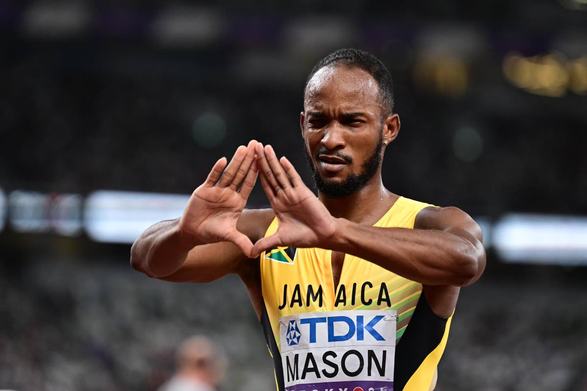 Tyler Mason finds a unique way of celebrating making it to the final of the men’s 100-metre hurdles where he would go on to earn a bronze medal at the World Athletics Championships inside the Japan National Stadium in Tokyo yesterday. 