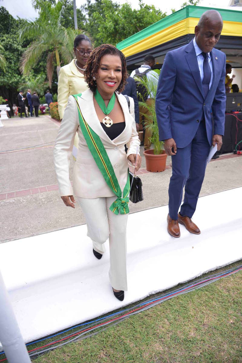 Audrey Marks, member of parliament-elect for Manchester North Eastern, paired a tailored ivory pantsuit with her Order of Jamaica insignia. 