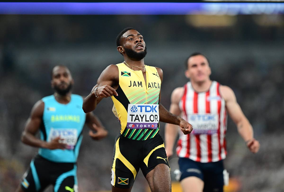 Christopher Taylor comes through the tape in heat four of the men’s 200 metres at the World Athletics Championships inside the Japan National Stadium yesterday. Taylor finished third in a personal best, 20.26 seconds to make the semi-finals 