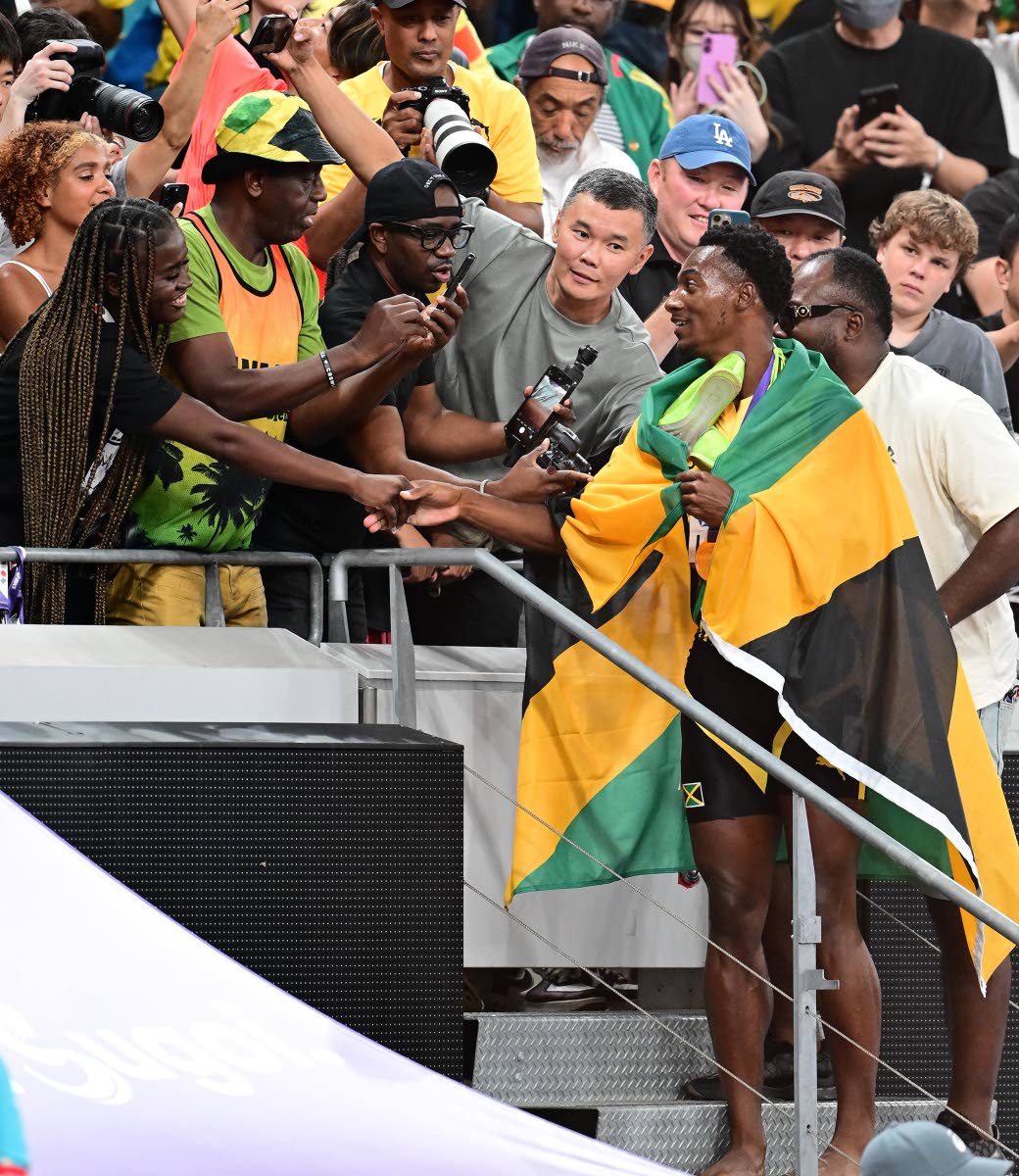 left: Noah Lyles’ fiancée Junelle Bromfield (left) congratulates Bryan Levell of Jamaica after he won a bronze medal in the men’s 200 metres final.