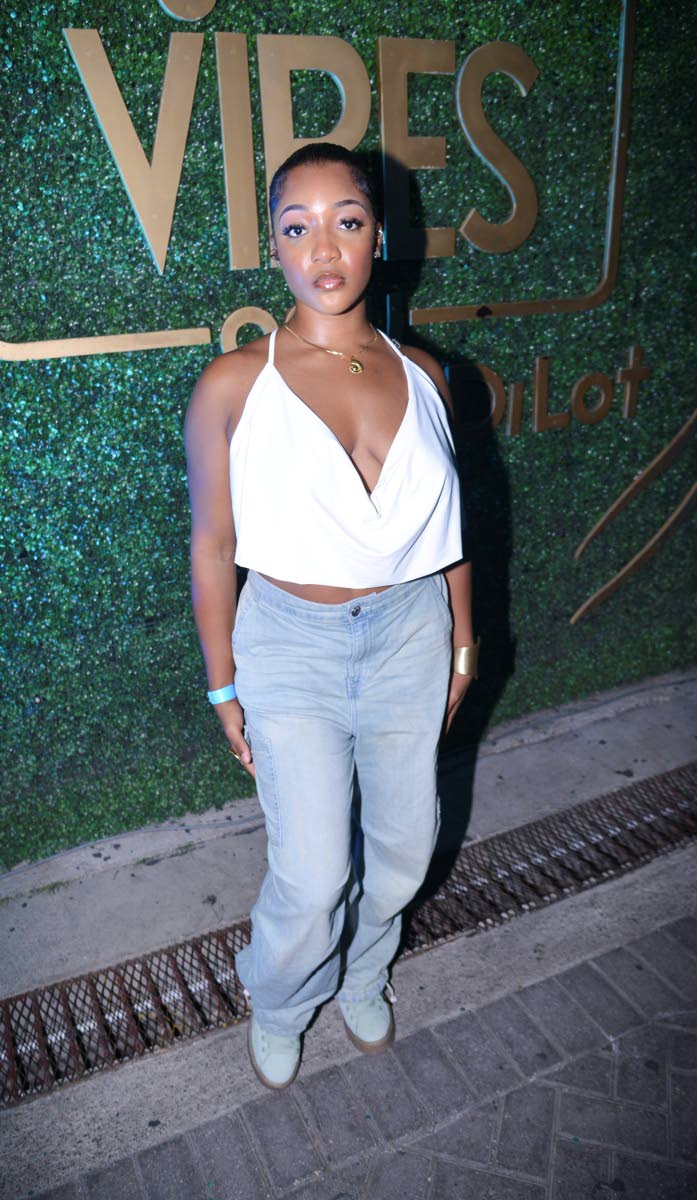 ‘Bidi Bidi’ singer Xhae shows off her soft glam in a plunging crop top and denim jeans.