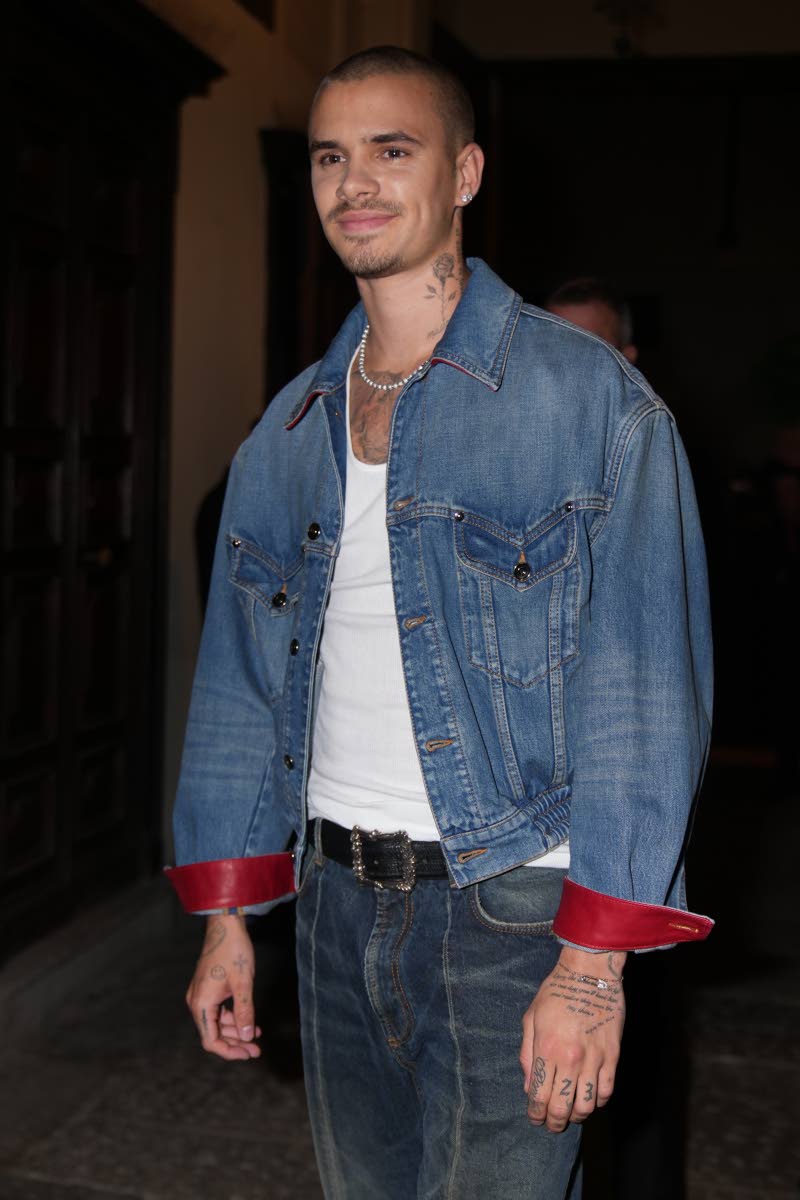 Romeo Beckham arrives for the Versace Intimate fashion event in Milan on Friday.