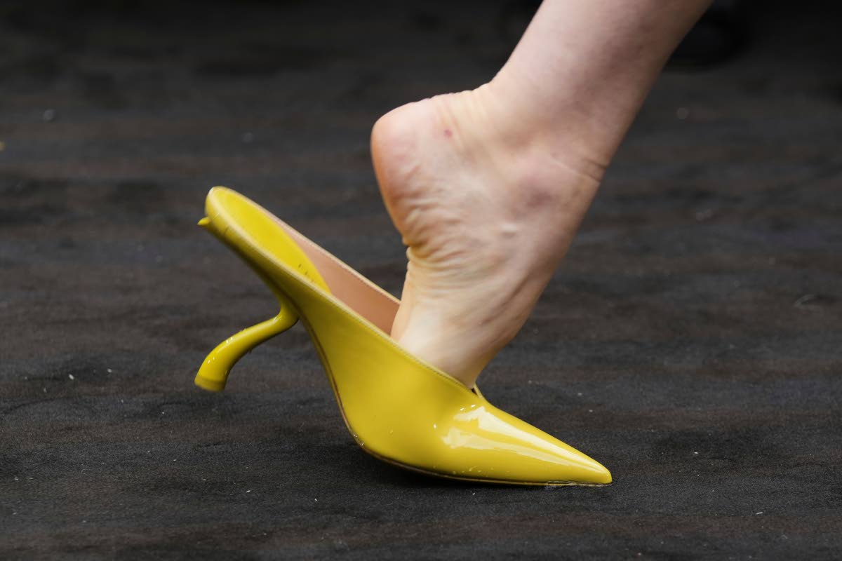 A model wears a chartreuse pointed mule on the runway for Ferragamo women’s Spring-Summer 2026 collection, which was presented in Milan, Italy, last Saturday.
