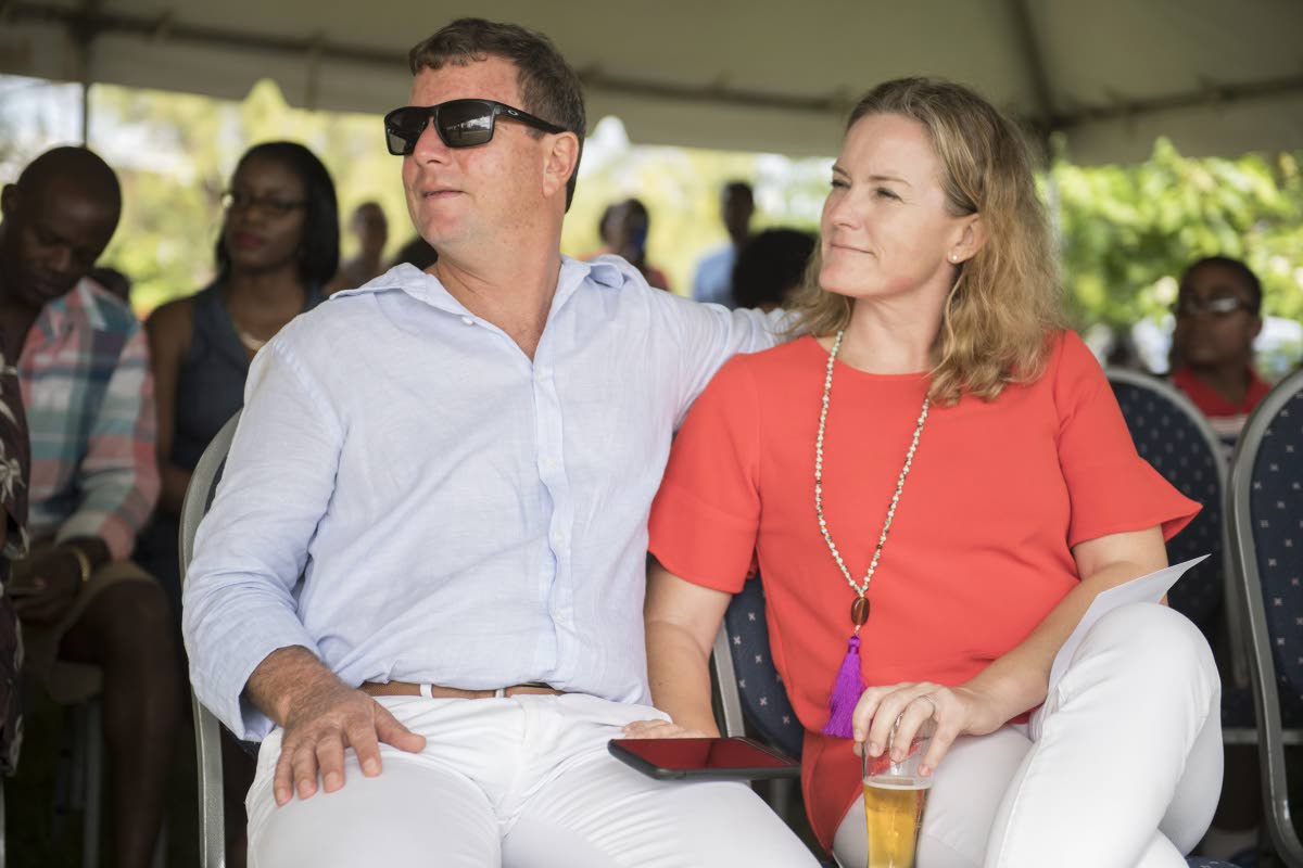 Jason Henzell (left) and his wife, Laura.