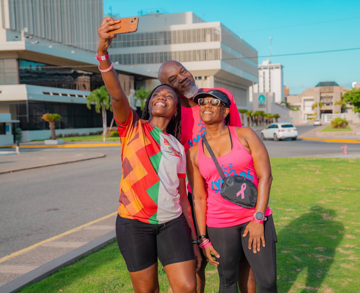 Say cheese! From left: Charlette Rowe, commercials operations manager, Carlos Watson, machine technician, and Noelle Brown of the Lymers Run Club, snap a selfie to mark the finish.