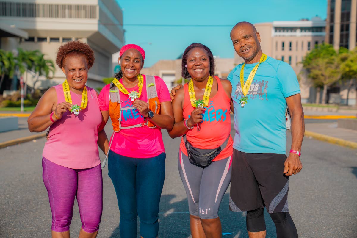  Proud finishers (from left) Jackie Innis, Tracy Cowan Richardson, Claudine Murray, and Dennis Hickey, are all smiles.