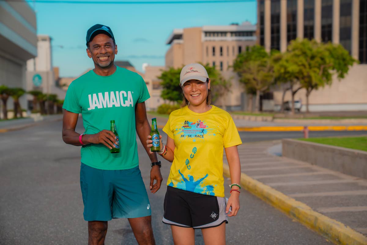 Husband-and-wife duo Dr Carey Wallace, executive director of the Tourism Enhancement Fund, and Vivene Levison, Great Huts managing director, enjoy a cold Heineken 0.0.