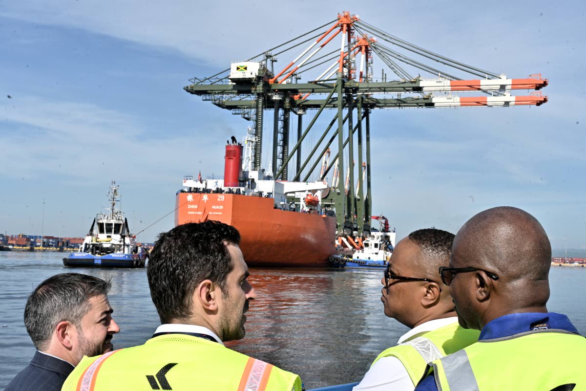 Kingston Freeport Terminal staff looks on as the Port Authority of Jamaica and Kingston Freeport Terminal Limited officially welcome the arrival of two new Super Post-Panamax cranes – a US$20-million investment aimed at expanding Jamaica’s capacity to 