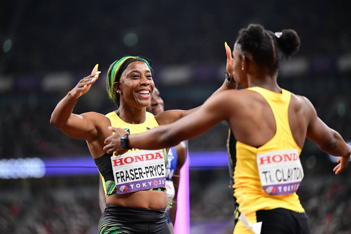 Shelly-Ann Fraser-Pryce celebrates the silver medal Tina Clayton won during the last individual 100-metre race of the former’s career at the World Athletics Championships in Tokyo, Japan last month. Fraser-Pryce announced her retirement from all competit