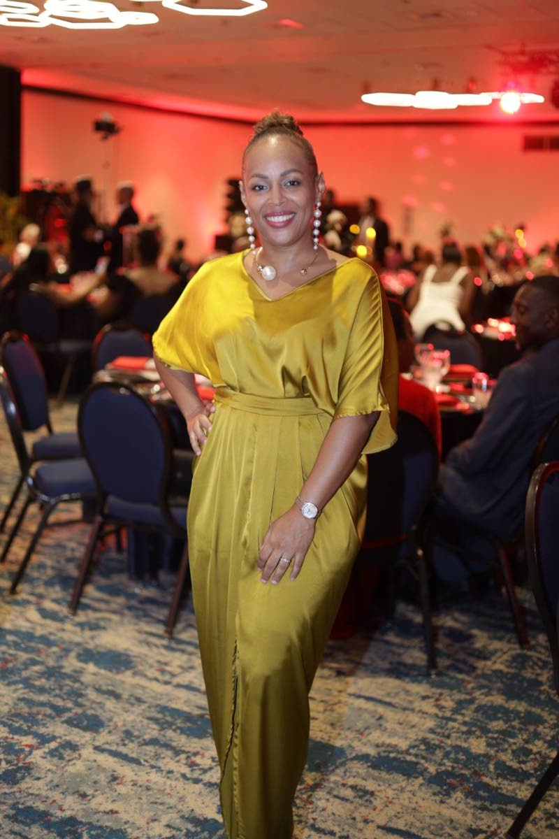 Toni-Ann Neita-Elliott, vice-president of sales and marketing at Sterling Asset Management Limited, looks effortlessly chic in a sleek satin dress.