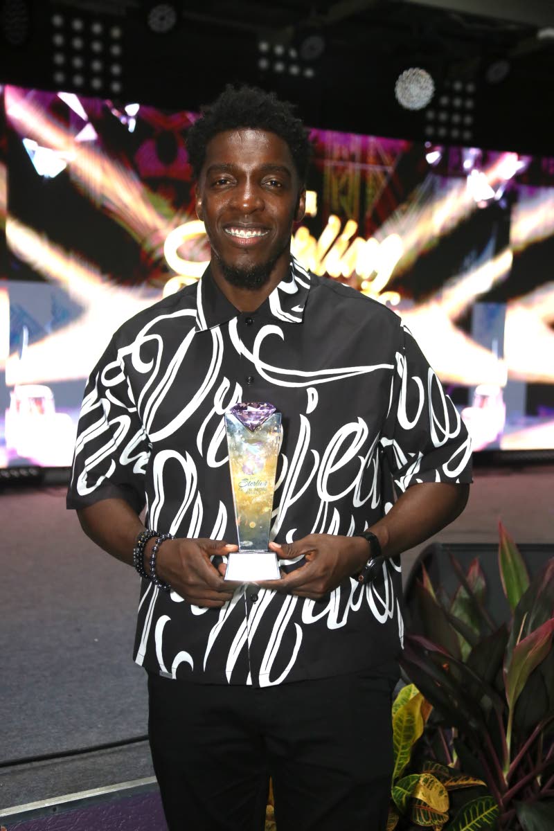 Johnmark Wiggan poses with his award at the Sterling Gospel Music Awards held last Saturday at Emmanuel Apostolic Church, Braeton Parkway, Portmore, St Catherine.