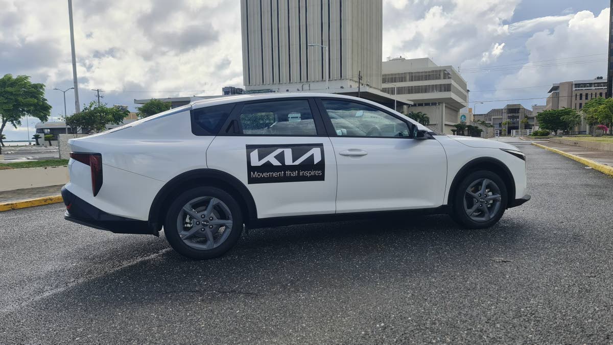 The fastback roofline and hidden C-pillar door handles create a seamless coupe-like profile, masking the sedan’s practical, extended wheelbase designed for class-leading passenger space.