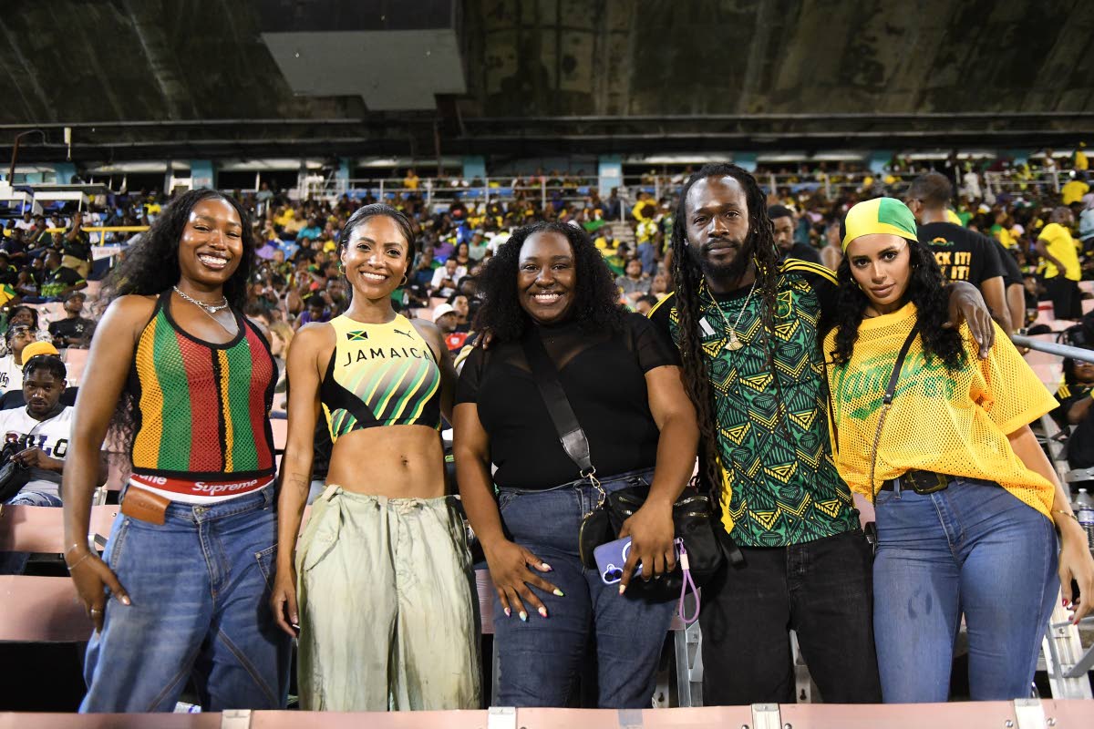 From left: Ayana Rivière, Naomi Cowan, Lauren ‘Lo’ Watkis, Jesse Royal and Gabriel Davis pose in the grandstand as the Reggae Boyz face Bermuda at the National Stadium in St Andrew on Tuesday.