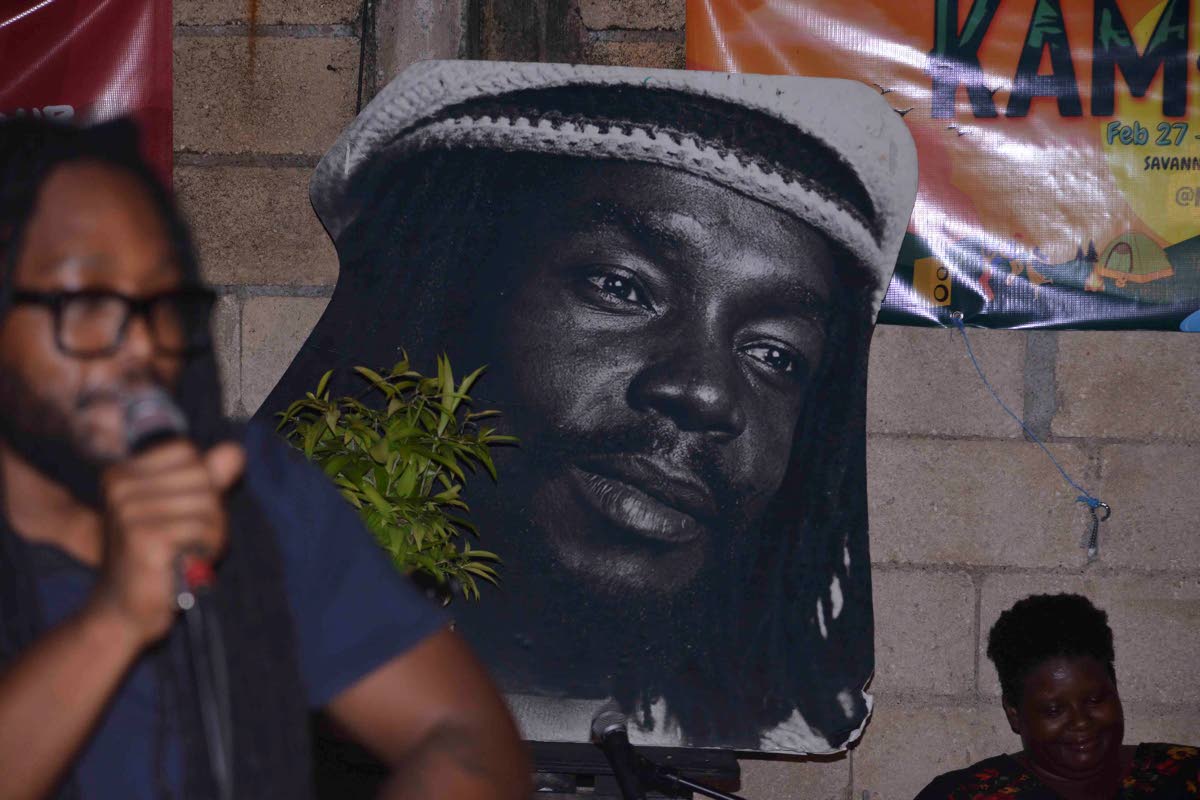 A portrait of Peter Tosh hung up in the yard of The Compound on Tuesday night.