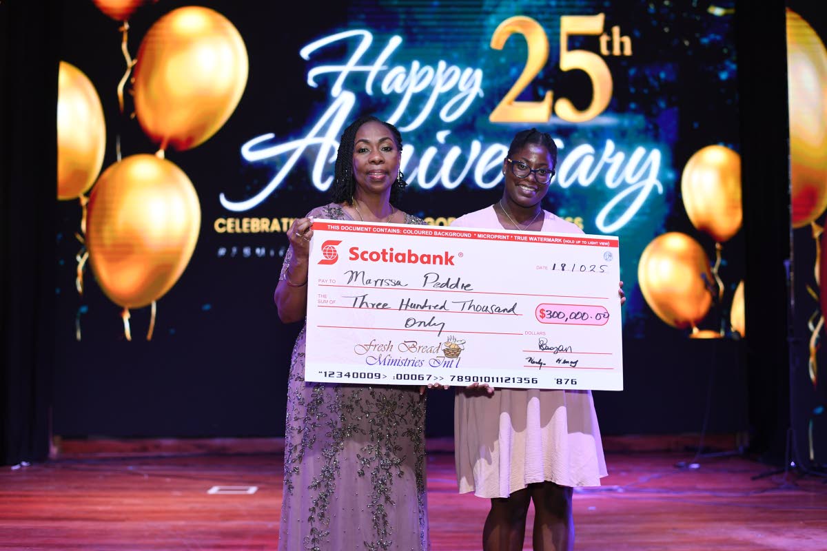 Marissa Peddie (right), recipient of the Bishop Philmon Samuels Scholarship, accepts a cheque representing the scholarship towards her degree in primary education at Sam Sharpe Teachers’ College from Olga Samuels, senior founding pastor of the Fresh Brea