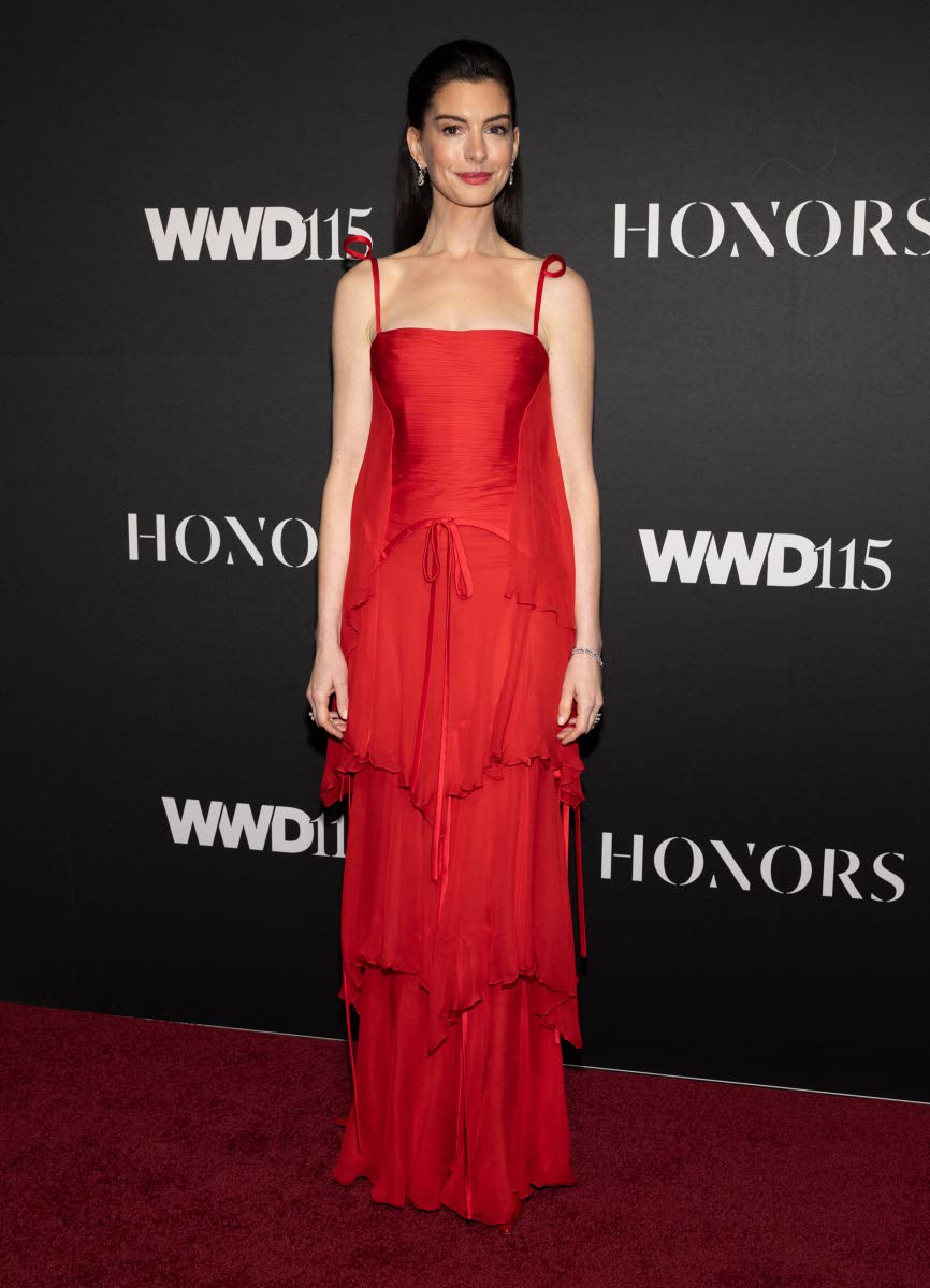 Anne Hathaway, wearing Valentino Couture, presented Valentino Garavani and Giancarlo Giammetti with the 2025 John B. Fairchild award at the WWD Honors event.