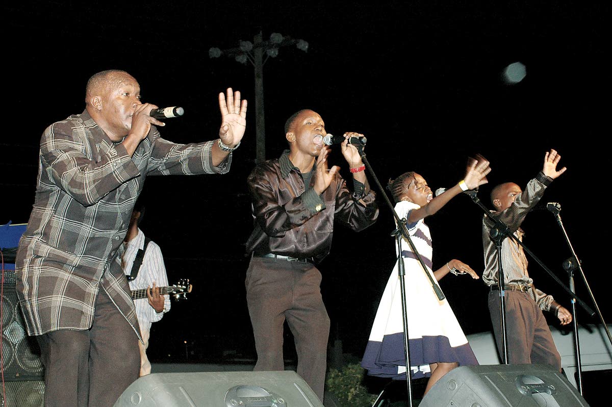 In this October 2006 photo, Lubert Levy (left)  and his children, who comprise Levy’s Heritage, please the  crowd at the Evening of Musical Bliss concert held at Covenant Moravian Church, on Molynes Road with their harmonies and dance.