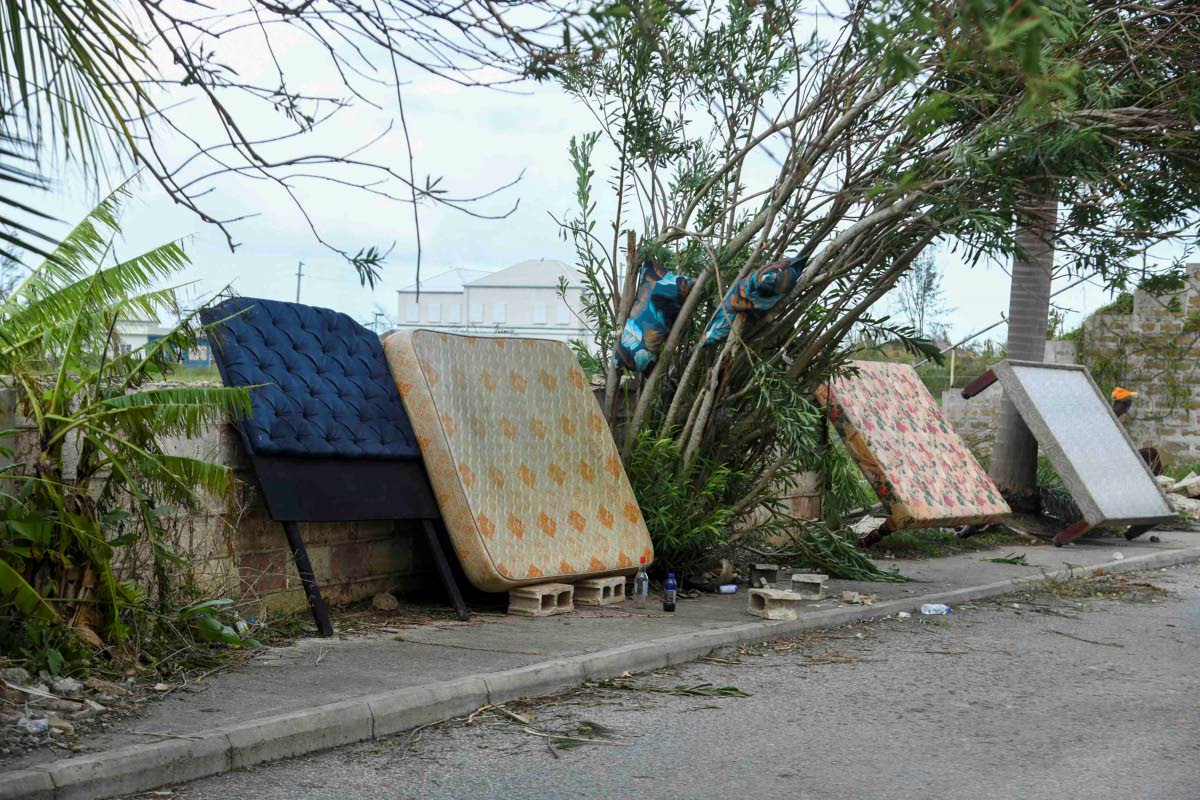 Residents of Cornwall Street in the Compound section of Falmouth, Trelawny put their mattresses along the road for drying after the passage of Hurricane Melissa.