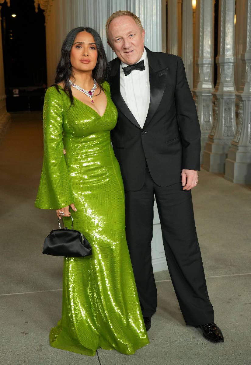 Above: Salma Hayek (left), in a green sequinned Gucci gown, and her husband, French businessman François-Henri Pinault. 