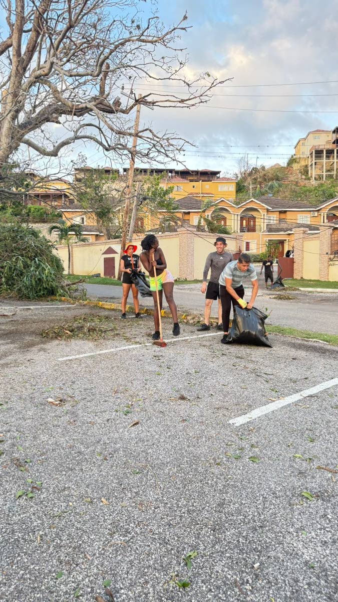 Employees of Hah-R-Mony Entertainment Limited assist with post-Hurricane Melissa cleanup efforts in Montego Bay, St James.