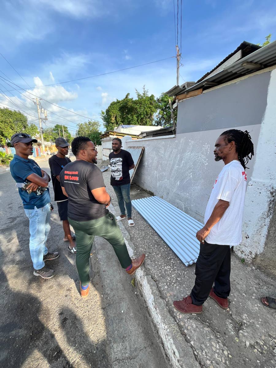 Rajae Danvers, founder and executive director of the Spread Love Initiative, in partnership with Alfrasure Structures and Roofing Limited, donated supplies to members of the Maxfield Avenue community.