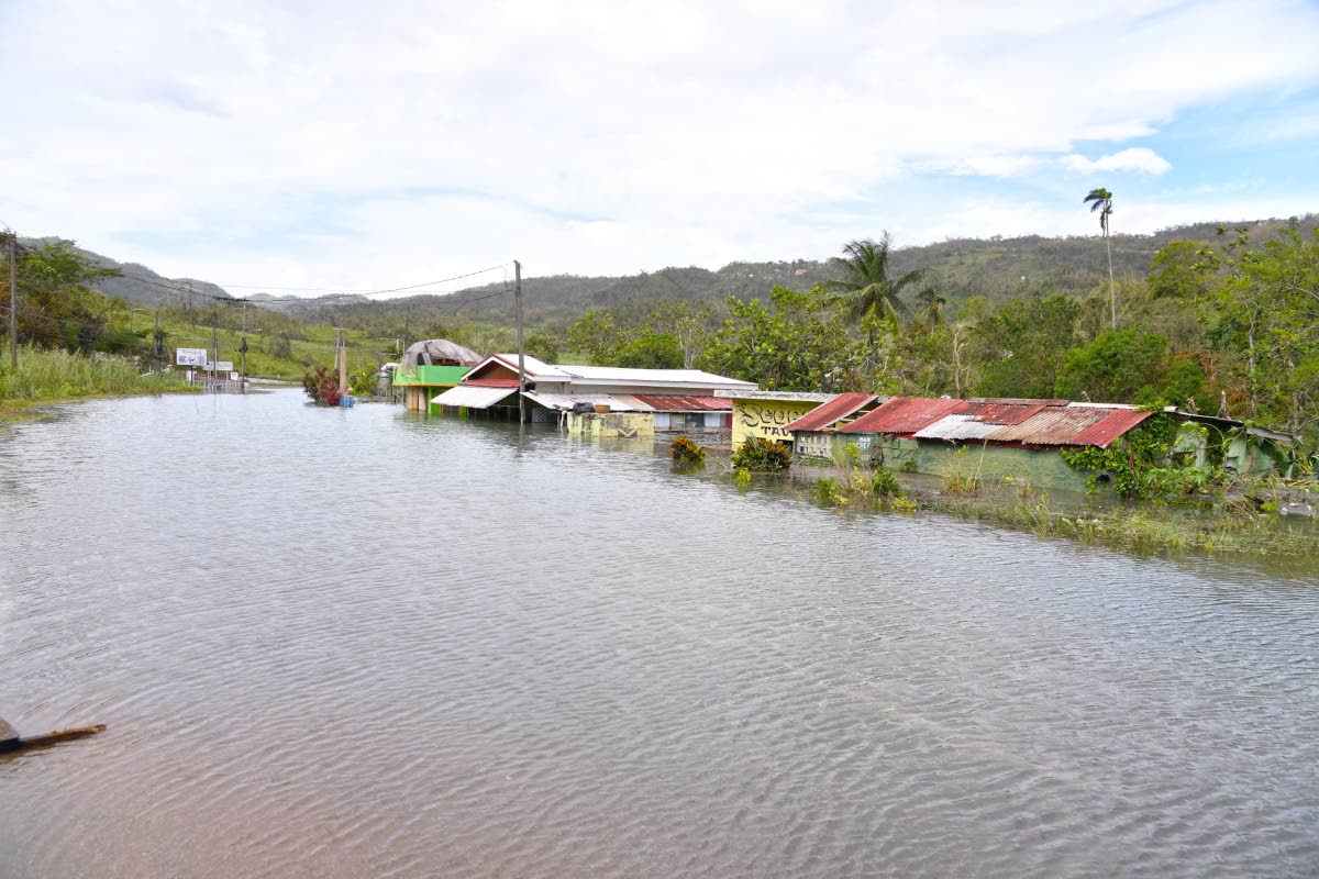 Rising water levels in Content in Williamsfield, Manchester, which inundated homes and business establishments.