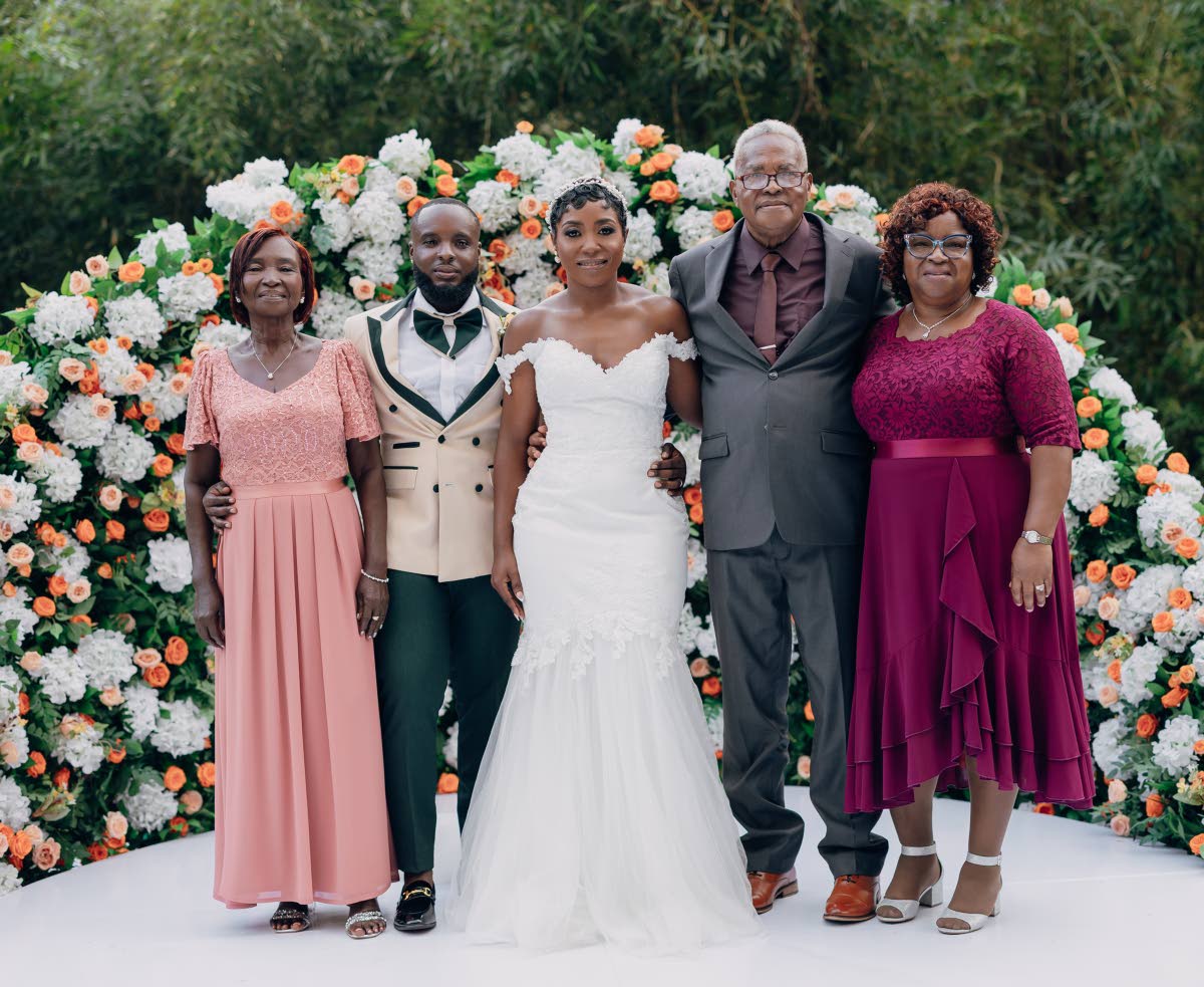 The lovely newly-weds are joined by their supportive parents, (from left) Leonie Stewart, and Winston and Maureen Francis.
