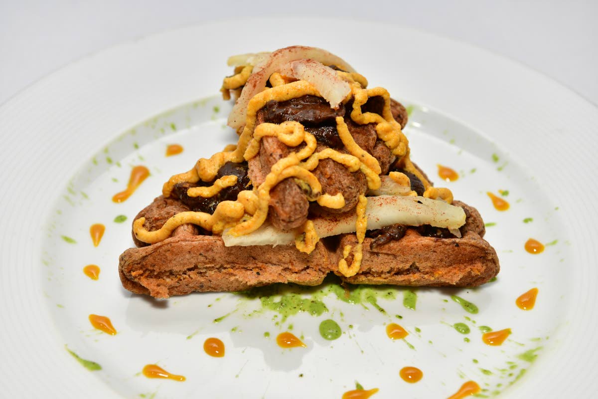 A Caribbean twist of savoury and sweet — gluten-free plantain waffles topped with jerk-seasoned mushrooms, caramelised onions and grilled pineapple.