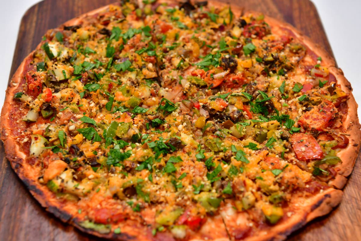 The roasted veggie flat pizza layers seasonal vegetables on a handmade, wholegrain base — a lighter take on pizza that’s as wholesome as it is indulgent.