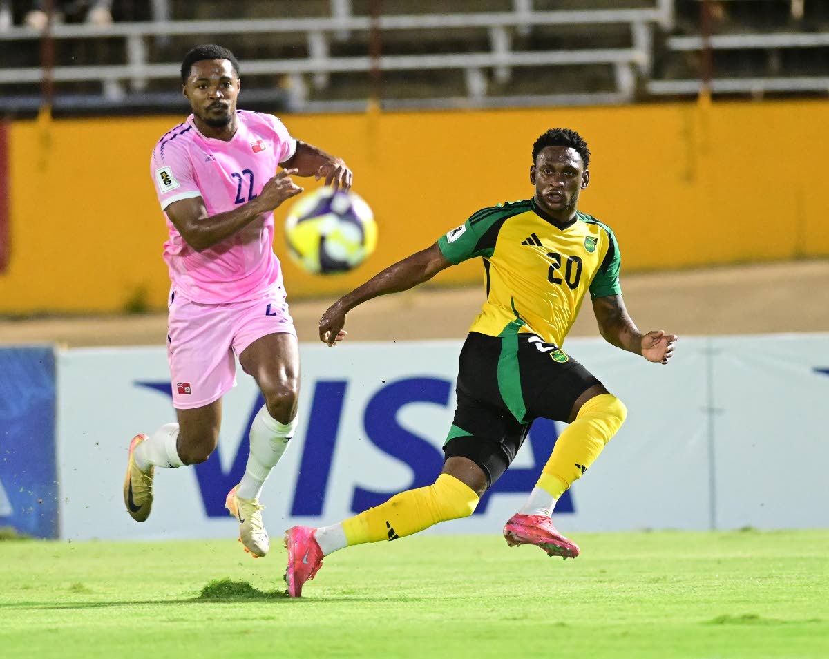 Renaldo Cephas (right) moments after the cross which assisted Bobby Reid to Jamaica’s second goal against Bermuda in a World Cup Qualifier played at the National Stadium in Kingston on October 14. The Reggae Boyz thrashed Bermuda 4-0.