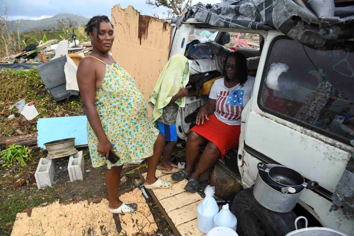 Crystal Morris stands outside the cramped minivan where she shelters with her mom, son and two other relatives in New Works, Westmoreland.