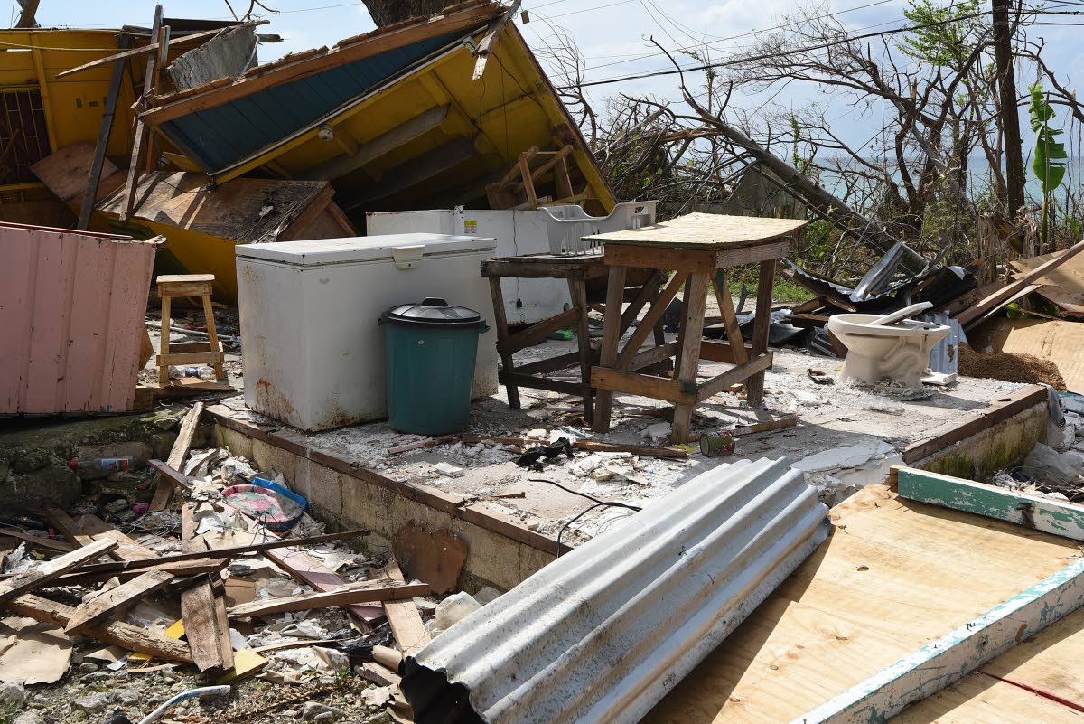 A collapsed board house in Bluefields reflects both the scale of destruction and the urgency of rebuilding efforts in Westmoreland.