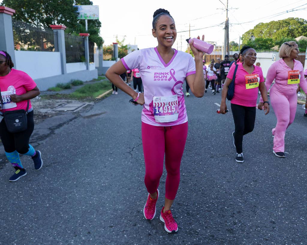 Waving to the camera mid-5K is media personality and attorney-at-law Talia Soares-Brown.