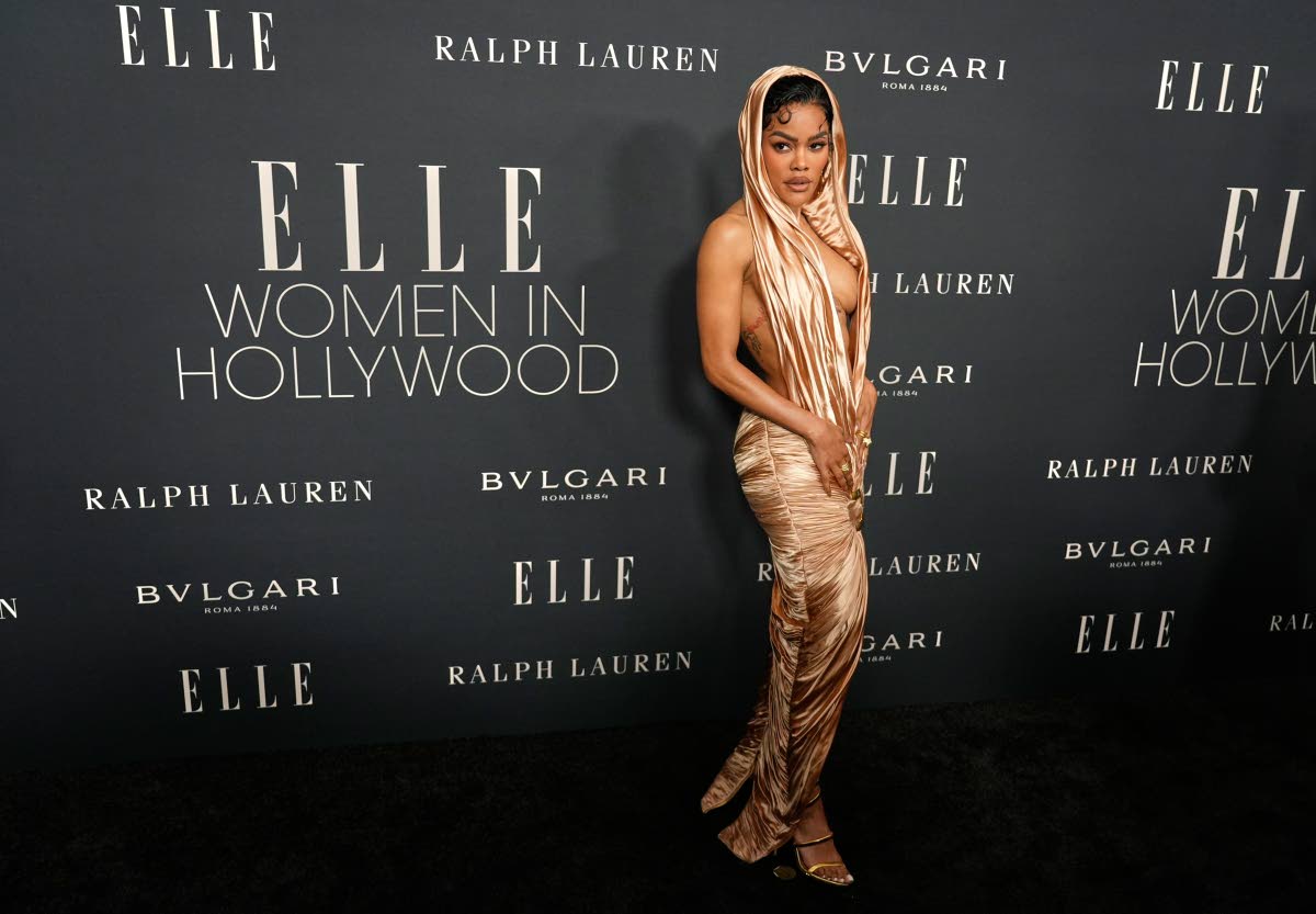 Elle Women in Hollywood honouree Teyana Taylor wore a golden, plunging, hooded Balmain gown. 