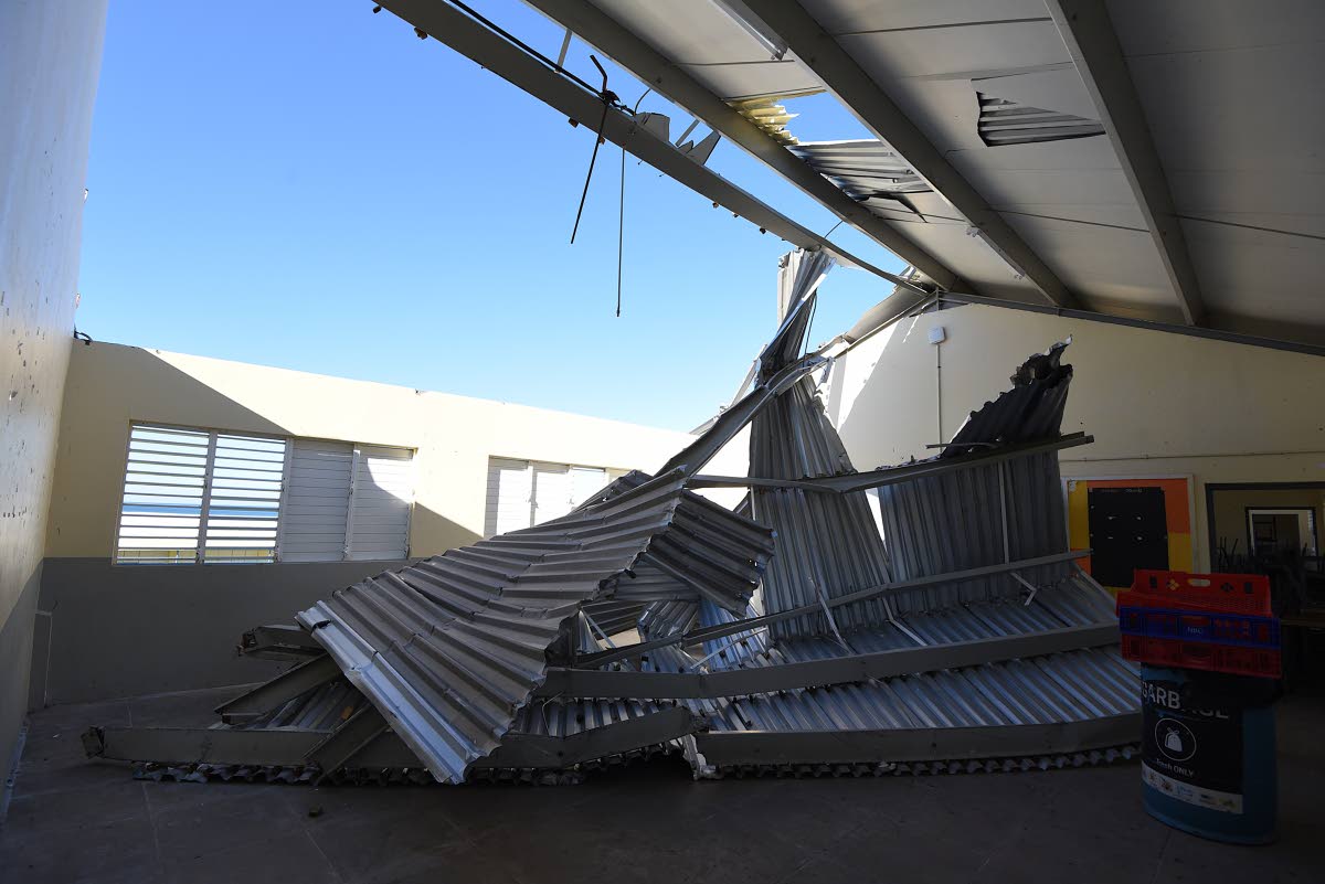 Another classroom with a damaged roof.