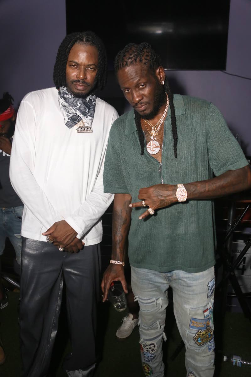 Govana (left) and Aidonia ‘hold a reasoning’ after the concert at Usain Bolt’s Tracks & Records.