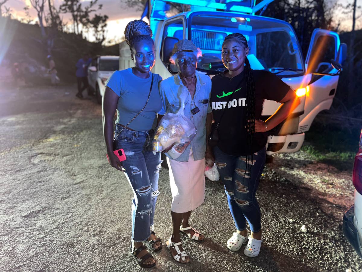 Robyn McDonald and Akayla Pearce, volunteers with the Sheffield Seventh-day Adventist District of Churches group, along with 82-year-old Eunice Hemmings, who had to jump through a window during Hurricane Melissa’s peak to run to safety.