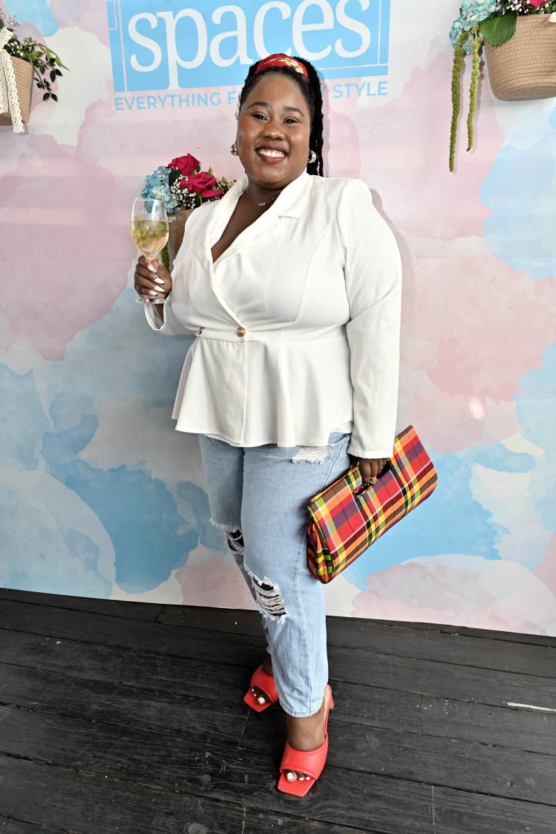 Donnielle Robe, marketing manager at Tile City/Kohler, adds pops of colour to her look, accessorising with her favourite clutch from Stush by the Pound.