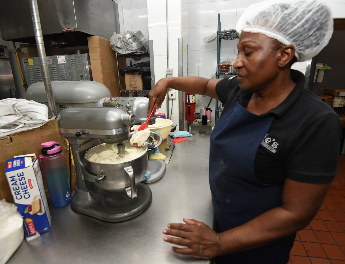 Winsome Gardener mixes brandy butter for the celebration’s dessert offerings.