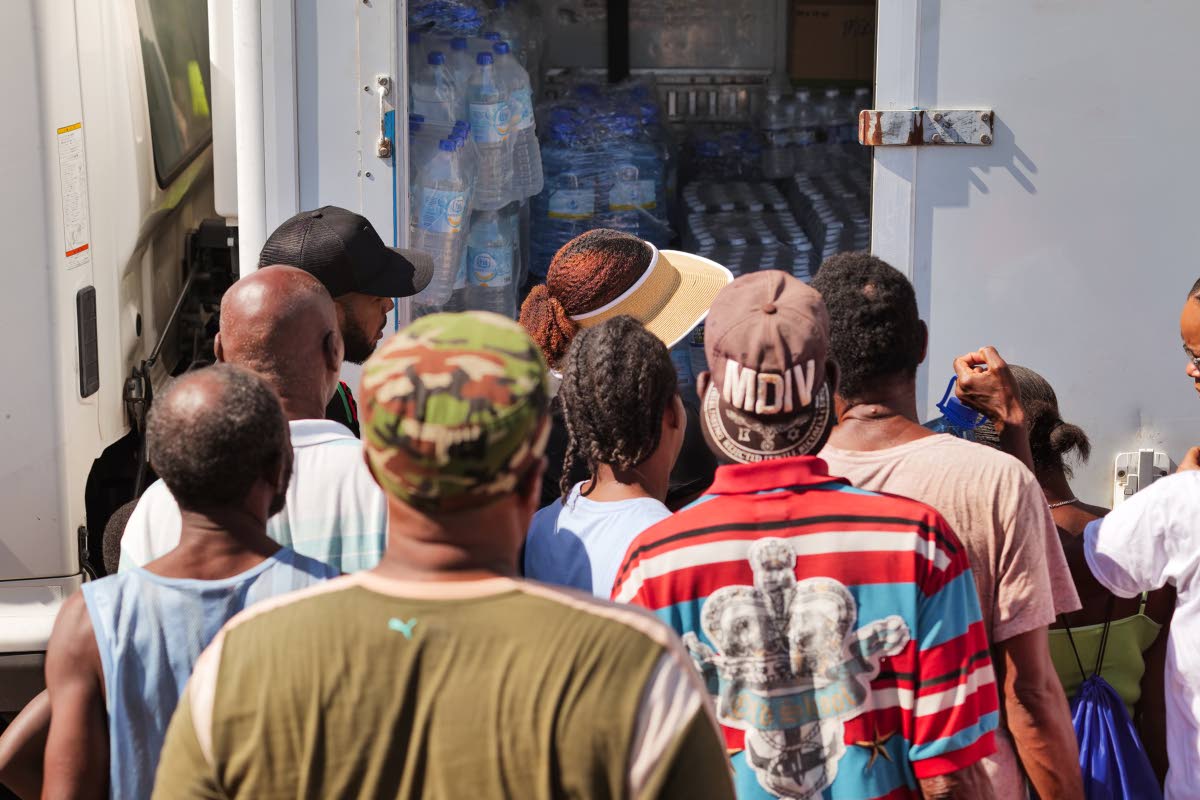 Residents across South West St Elizabeth receive sleeping bags, solar lanterns, water and care packages delivered by the Hurricane Relief Command Centre and Tank-Weld Metals Ltd.