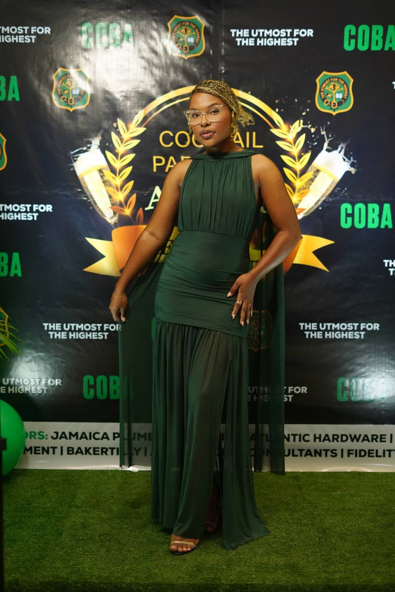 Communications strategist and Gleaner writer Nyoka Manning embodied effortless grace in a flowing emerald-green gown, styled with soft pleats, a cinched waist, and a cape detail that added movement and drama.