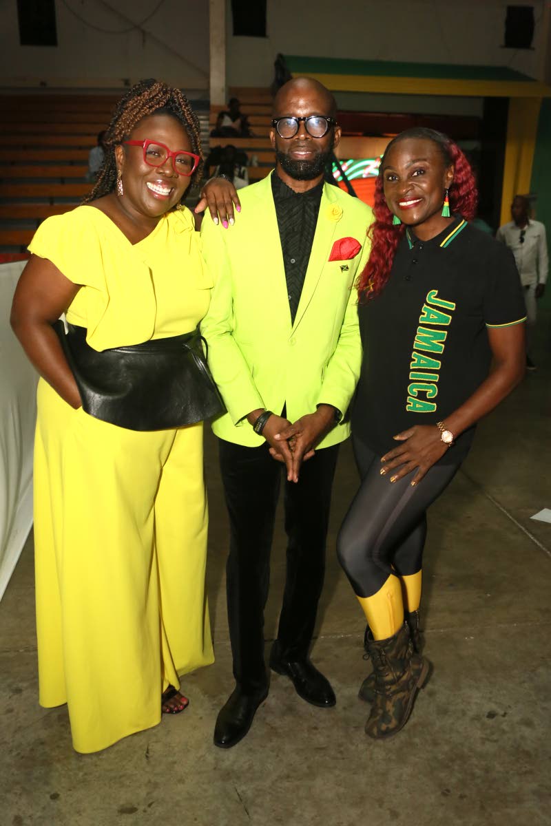 Decked out in their Jamaican colours are (from left) media personalities Nadine Blair, Markland Edwards and Jennifer ‘Jenny Jenny’ Small.