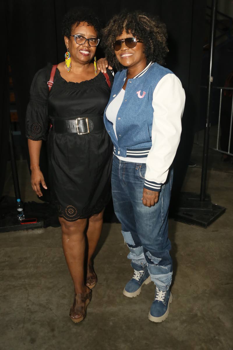 Reggae/dancehall artiste Tanya Stephens (right) captures the moment with Andi Green.