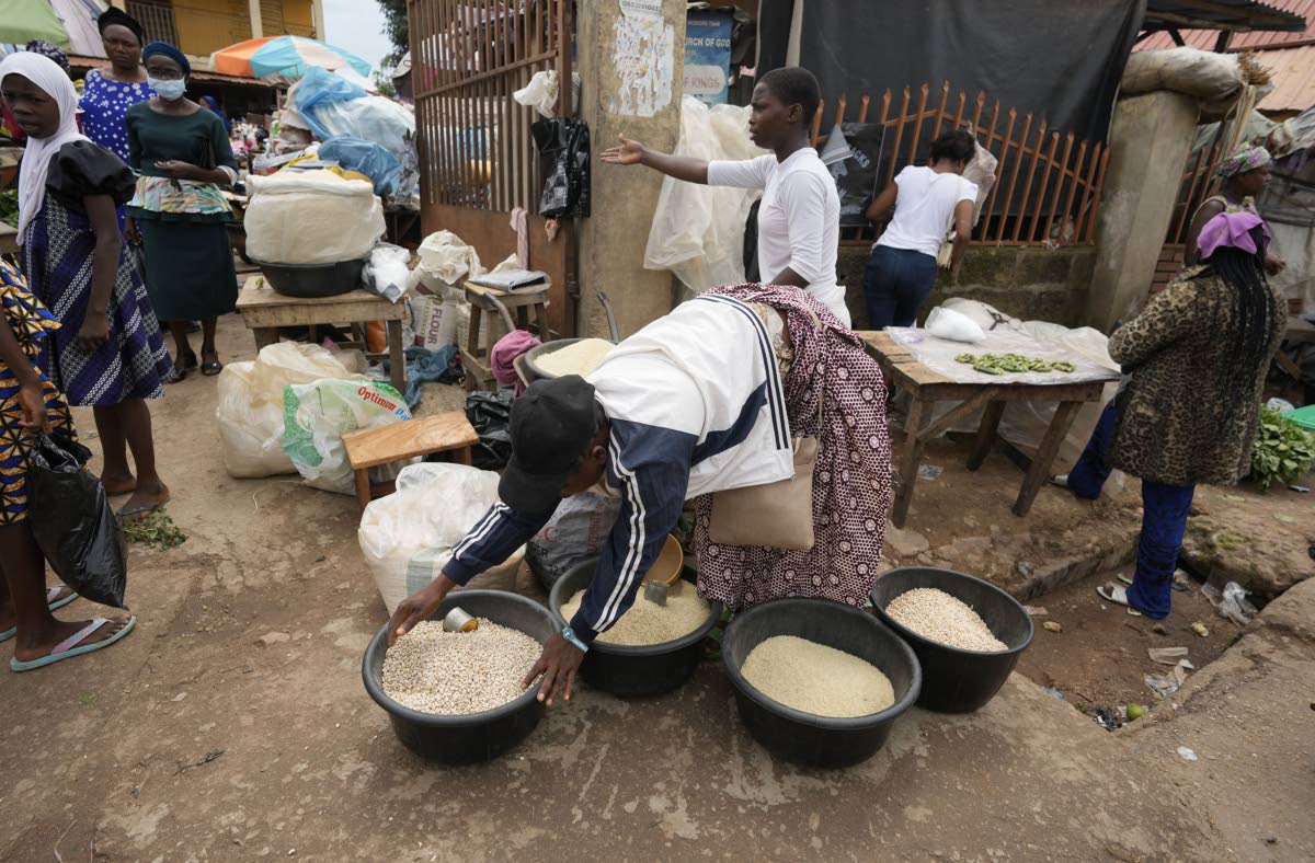 Women sell food items at a street market in Owo, Southwestern Nigeria.
