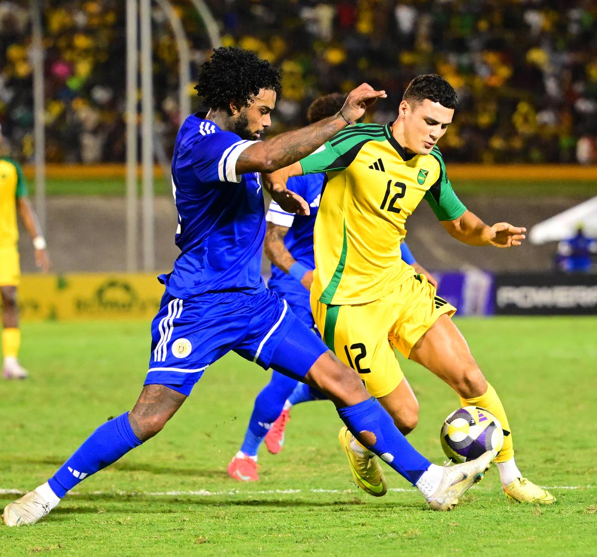 British-born Bailey Cadamarteri (right) in action for the Reggae Boyz against Curacao during a Concacaf World Cup qualifier at the National Stadium on Tuesday, November 18.