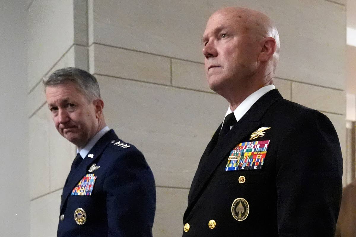 US Navy Adm Frank M. Bradley (right) accompanied by Gen Dan Caine, chairman of the Joint Chiefs of Staff, walks to a meeting with senators on Capitol Hill in Washington on Thursday.