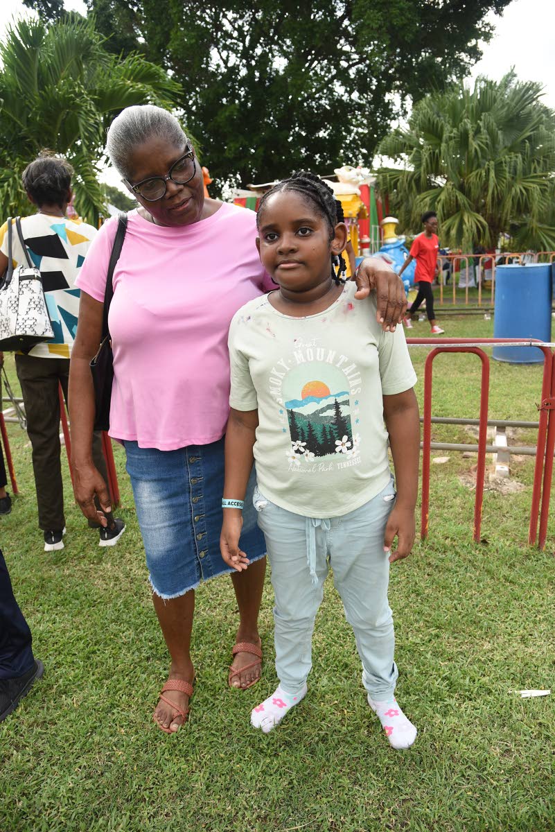 Michelle James (left) with her granddaughter Gabrielle Francis during the Digicel Foundation Christmas treat.